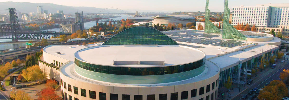 The Oregon Convention Center with the city of Portland in the background.