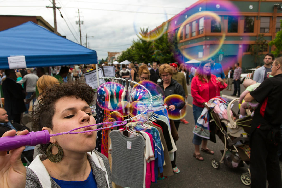 portland of person blowing bubbles at a parade in Portland