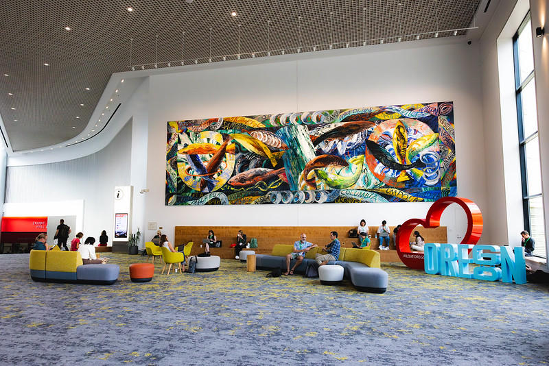 A large colorful painting (Riversong, 1990, by Linda Parker) sweeps across OCC's bright Holladay Lobby.
