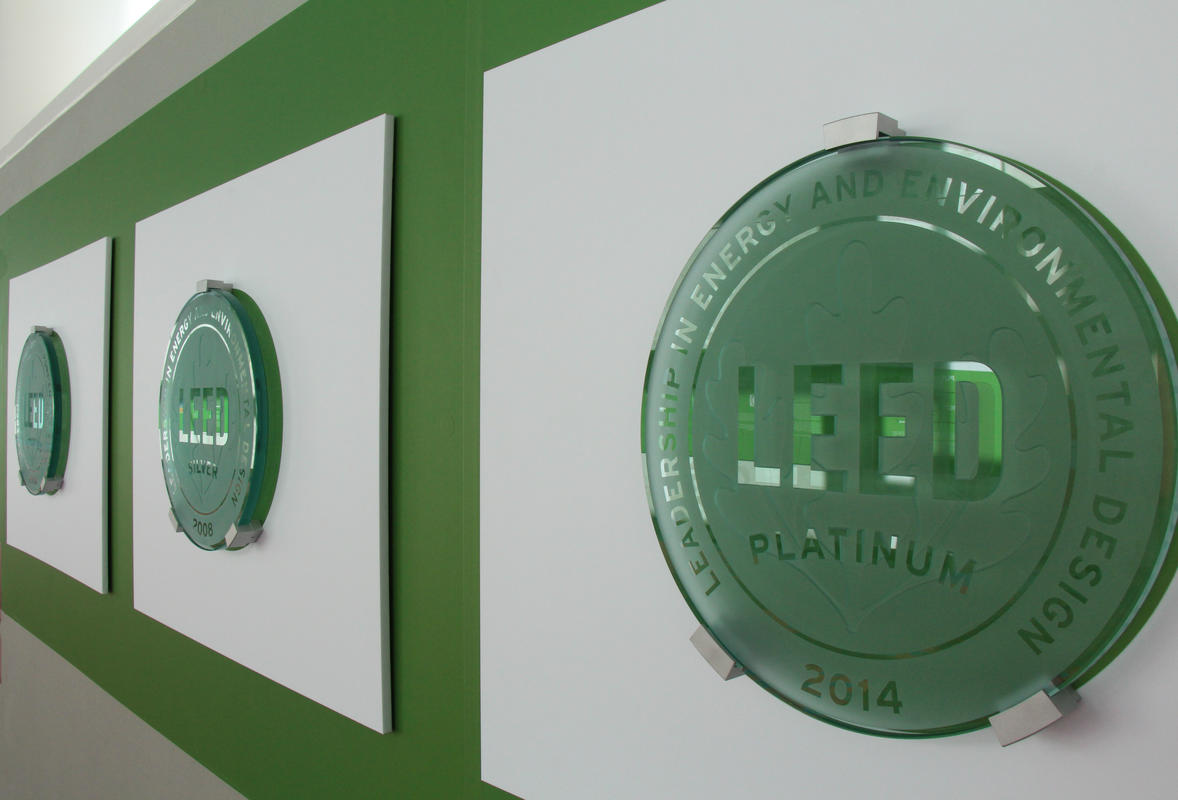 photo of LEED plaques on the green wall