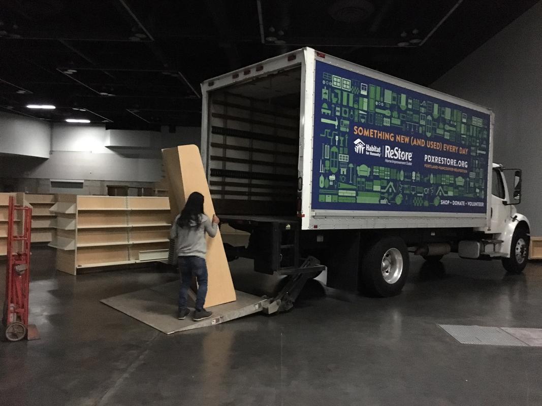 photo of Habitat for Humanity truck picking up resusable items following an OCC event