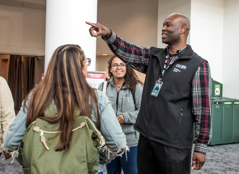 photo of an OCC Ambassador giving directions