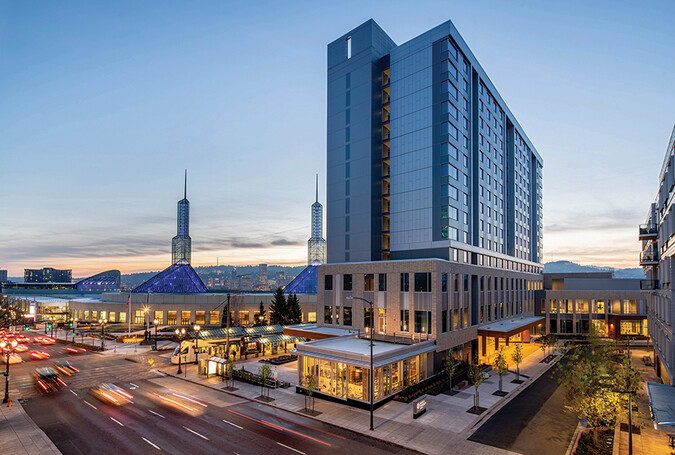Exterior OCC and hotel at dusk.