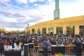 A large outdoor gathering with people.