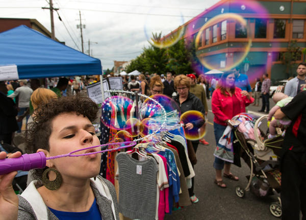 portland of person blowing bubbles at a parade in Portland