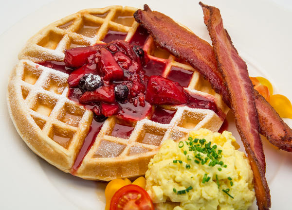 photo of belgium waffle with berry compote and bacon